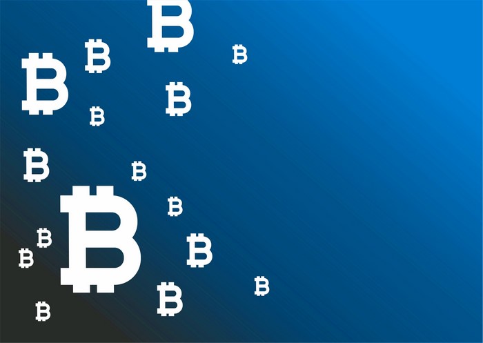 Bitcoin symbols on a blue gradient background