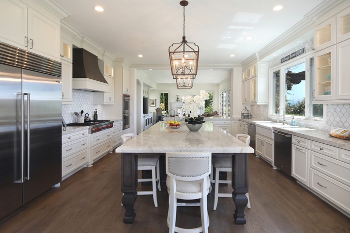 Kitchen with Island, Chandelier, and Table