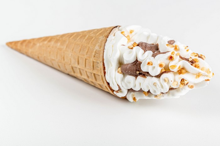Ice cream cone with chocolate and nuts