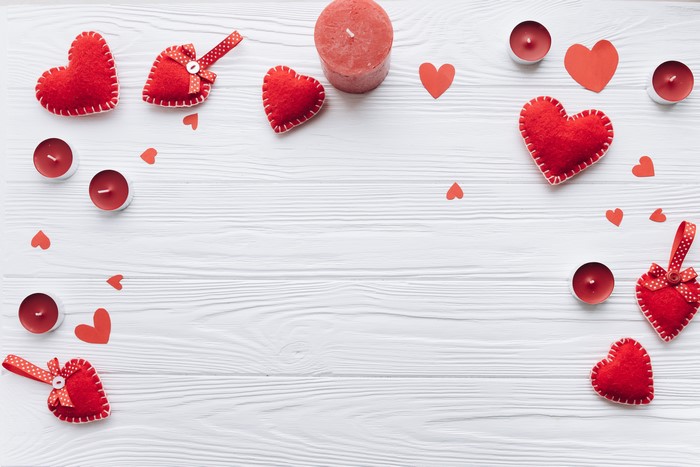 Valentine's Day Red Hearts and Candles on White Wood