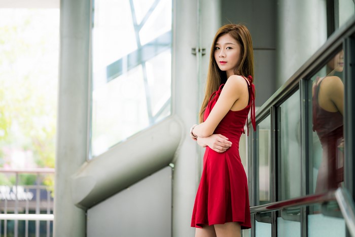 Asian woman in red dress