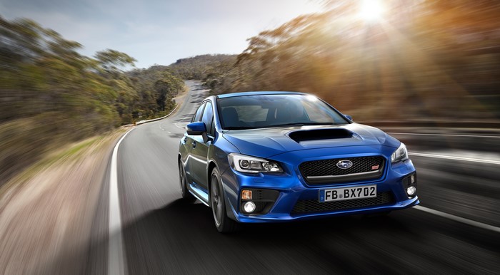 Blue 2017 Subaru WRX STI Sedan on a Winding Road