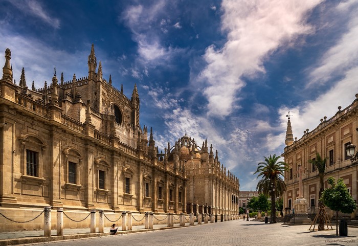 Seville Cathedral and Archivo de Indias under a cloudy sky