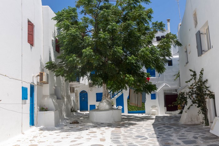 Courtyard with a tree in Mykonos, Greece