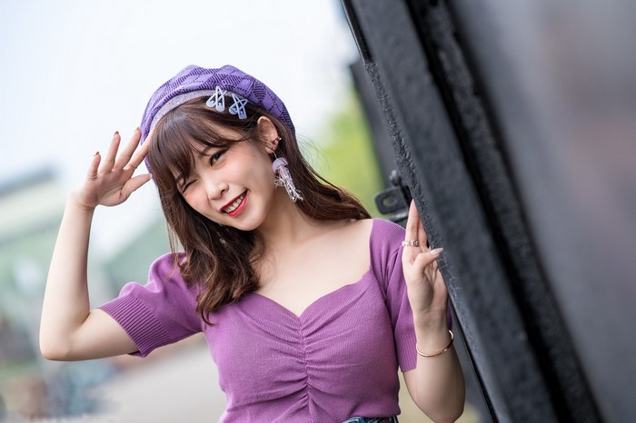 Asian girl wearing a purple beret and top