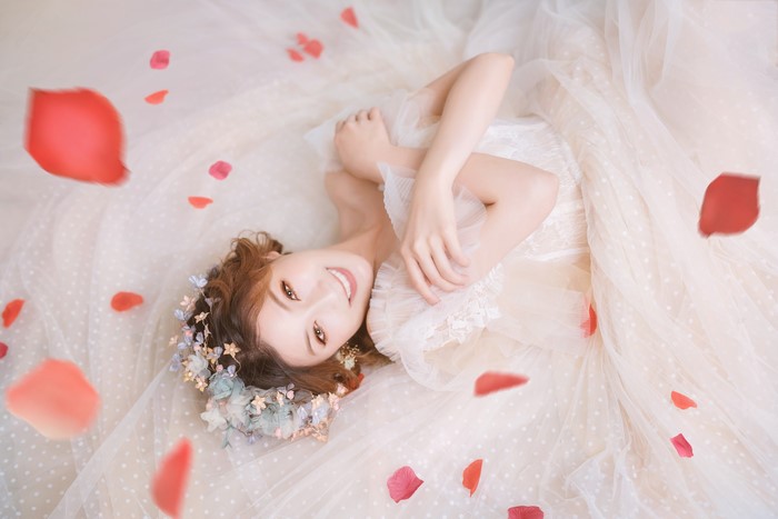 Bride with Brown Hair and Flower Crown Surrounded by Petals