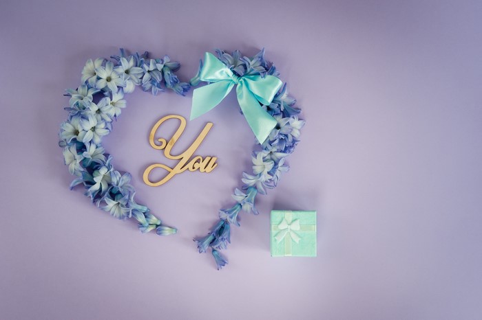 Heart made of flowers with "You" and gift