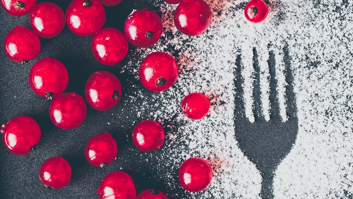 Red Currants and Fork with Powdered Sugar