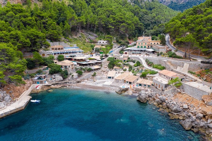 Coastal village with houses and trees in Majorca, Spain