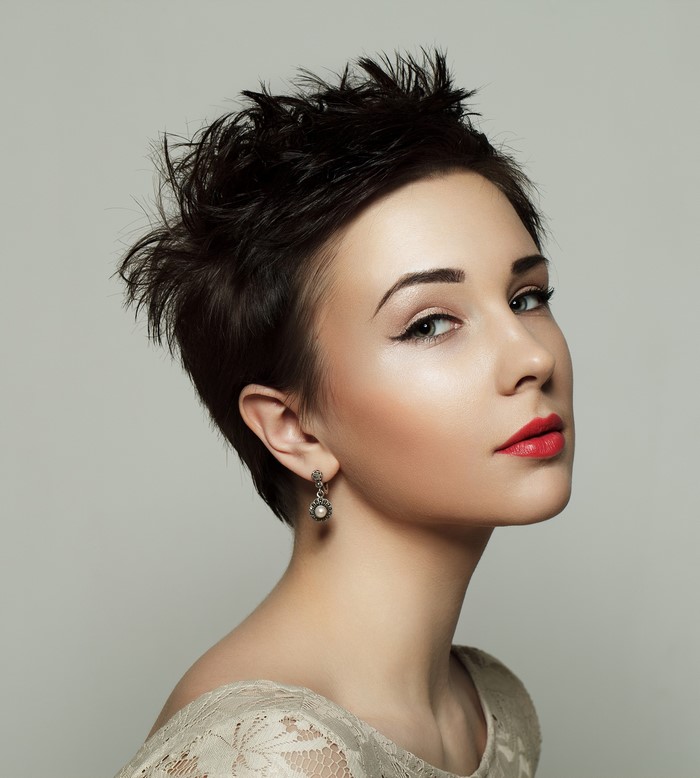 Brunette woman with red lips and short hair