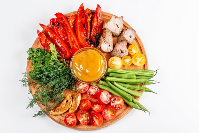 Vegetable platter with meat and dip