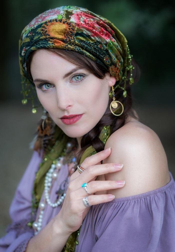 Woman in headscarf and jewelry