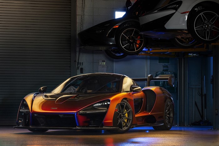 McLaren Senna in a garage with other cars