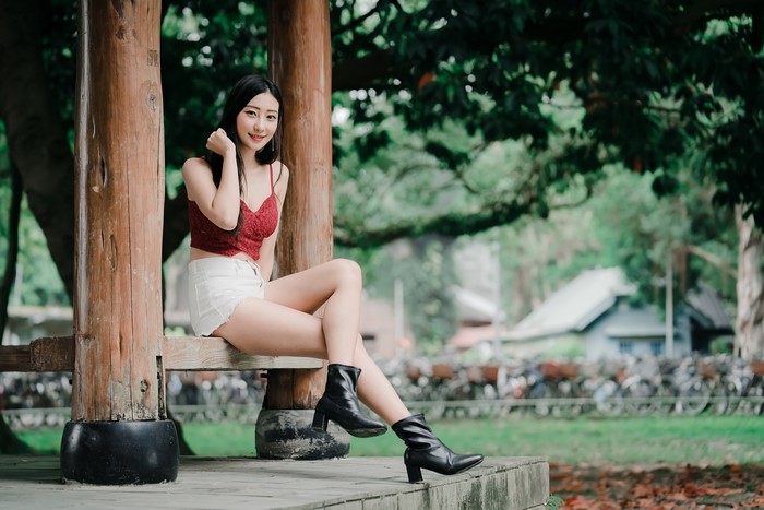 4K Asian Brunette Girl Sitting Outdoors