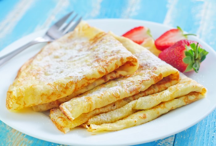 Pancakes with strawberries on a plate