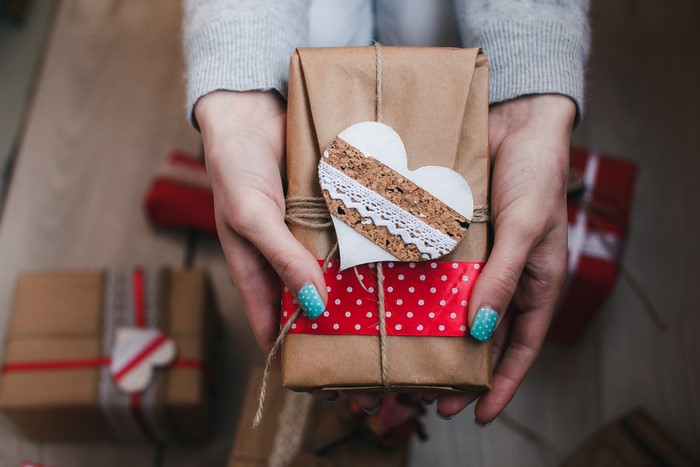 Hands holding a Valentine's Day gift box
