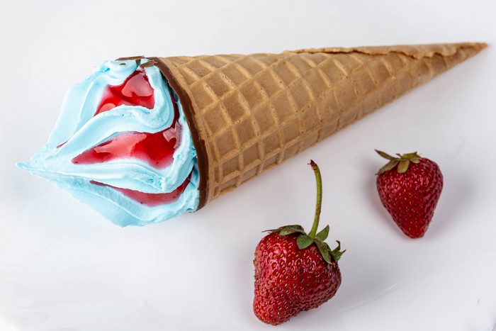 Ice cream cone with strawberry and blue ice cream