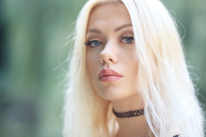 Closeup Portrait of Blonde Girl with Choker