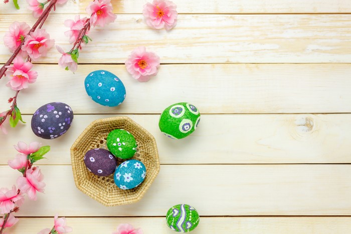 Easter Eggs on Wood Planks with Pink Flowers