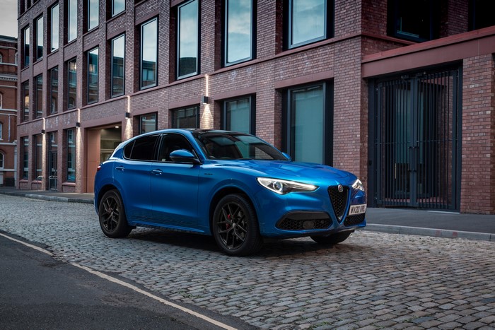Blue Alfa Romeo Stelvio Veloce Crossover on Cobblestone Street