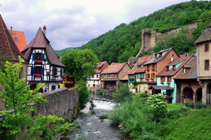 Alsace village with river and historic houses