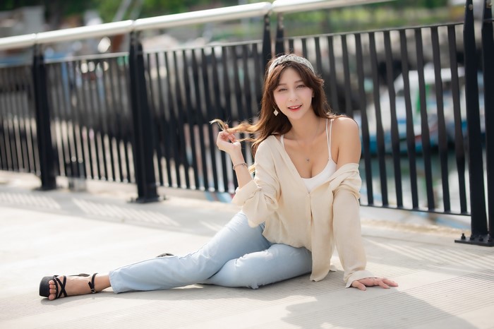 Asian woman sitting on the ground