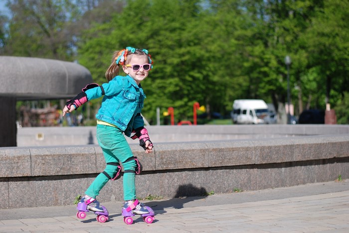 Girl in Roller Skates and Sunglasses