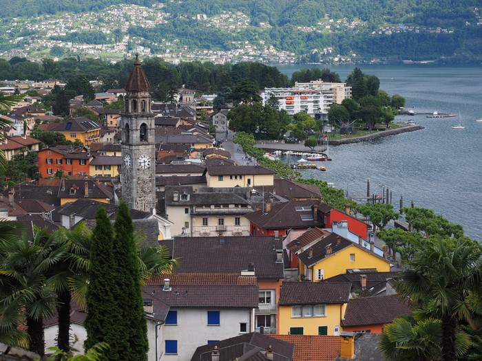 Town with Clock Tower on Lake in Switzerland