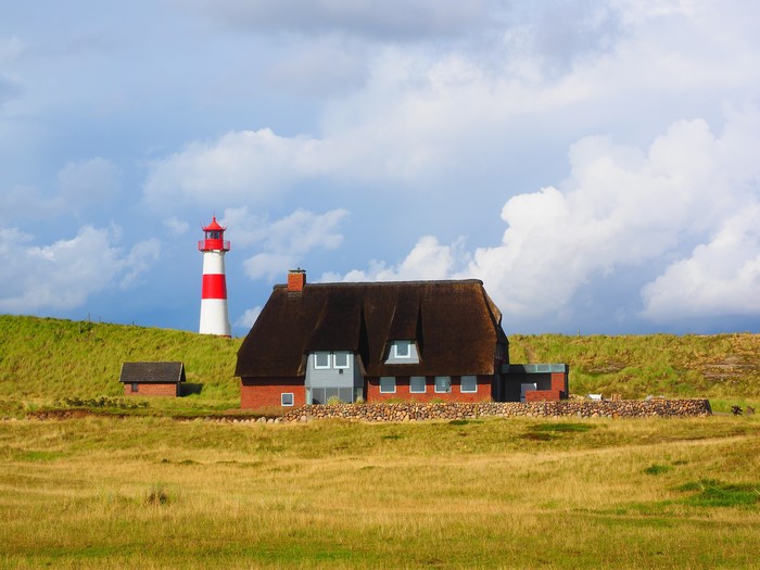 List-Ost Beacon and thatched house on Sylt island, Germany