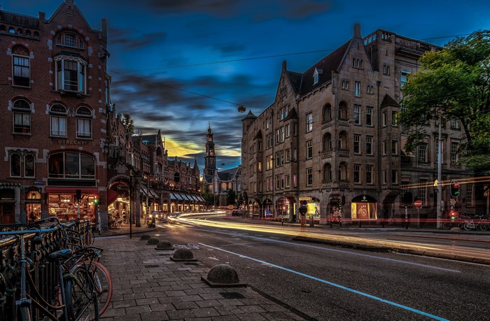 Amsterdam street at dusk with light trails