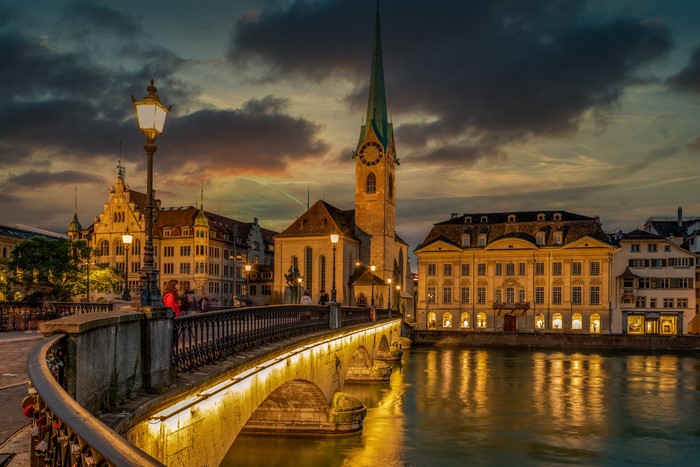 Zurich, Switzerland: Fraumunster Church and Bridge at Dusk