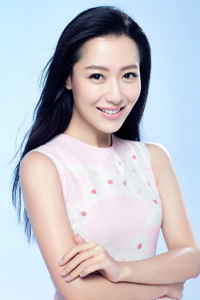 Bin Smiling Asian Woman with Brunette Hair