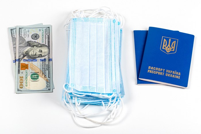 US Dollars, Face Masks, and Ukrainian Passports