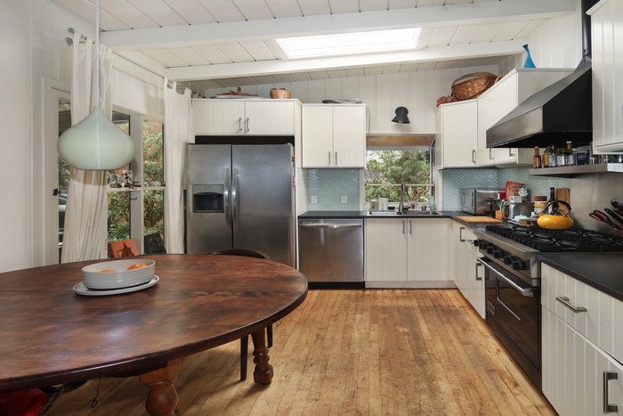 Kitchen with dining table and appliances