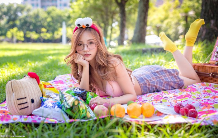 Asian woman with glasses at a picnic