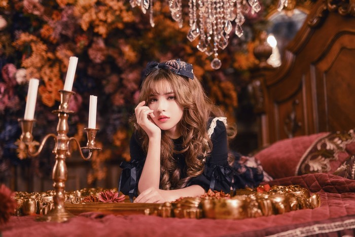 4K Portrait of a Brown-Haired Woman with Candles