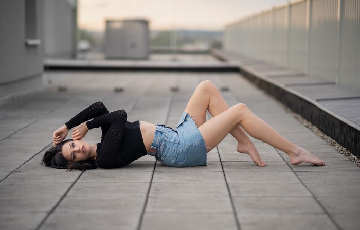 Laura Elena lying down on rooftop