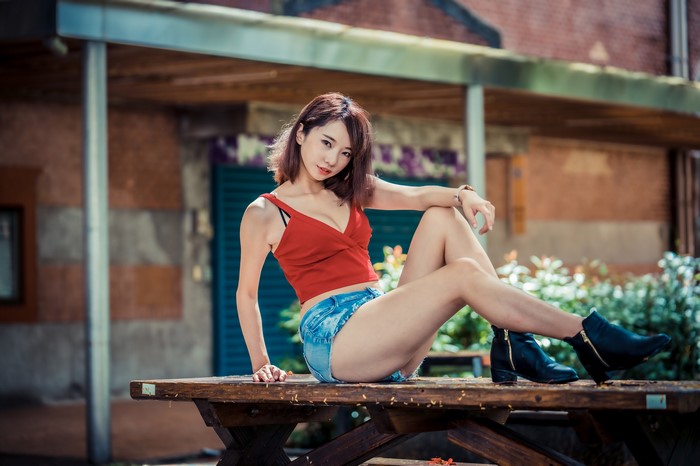 4K Asian Woman Sitting on Wooden Bench