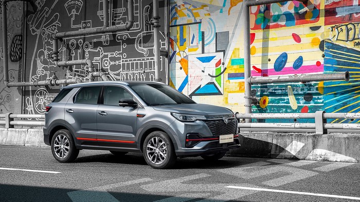 Changan CS55 Plus Blue Drive crossover parked by graffiti wall