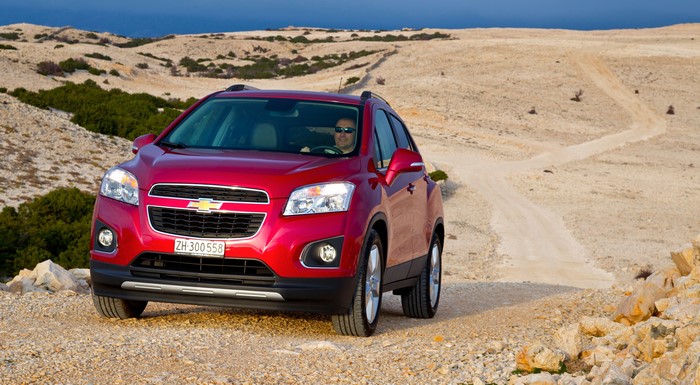 Red Chevrolet Trax Crossover on a dirt road