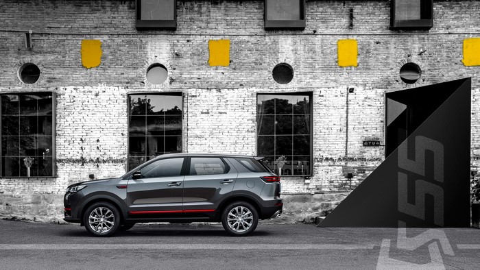 Changan CS55 Plus Blue Drive crossover parked by brick building