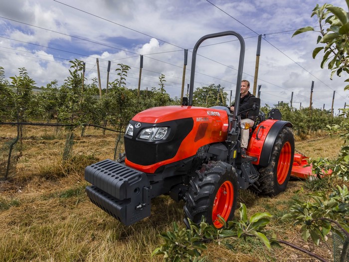 Kubota M5101N ROPS tractor in an orchard