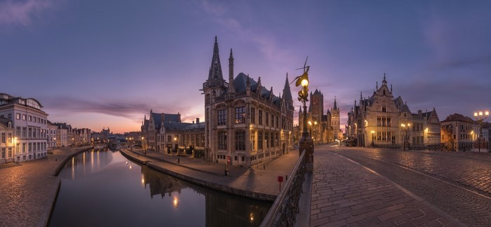 Ghent canal with historic buildings at dusk