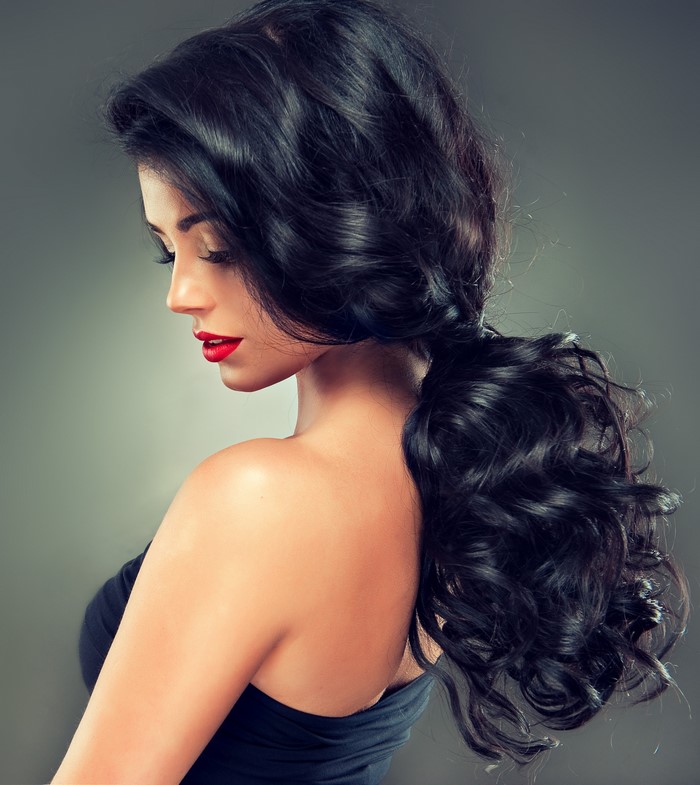 Brunette woman with red lips and black hair