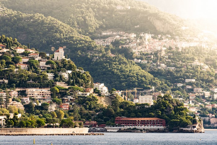 Houses on a hillside overlooking the sea