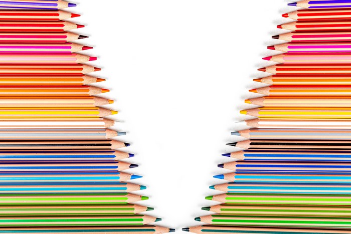 Many multicolor pencils on white background