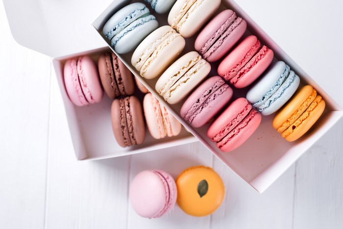 Assortment of colorful macarons in boxes