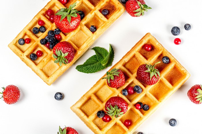 Waffles with Strawberries and Blueberries on White Background
