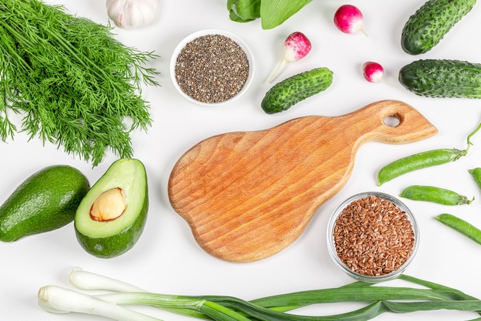 Vegetables and seeds on a white background