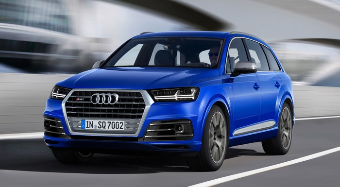 Blue Audi SQ7 TDI driving on a road